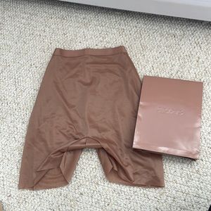 NEW WITH BOX Barely there low back short